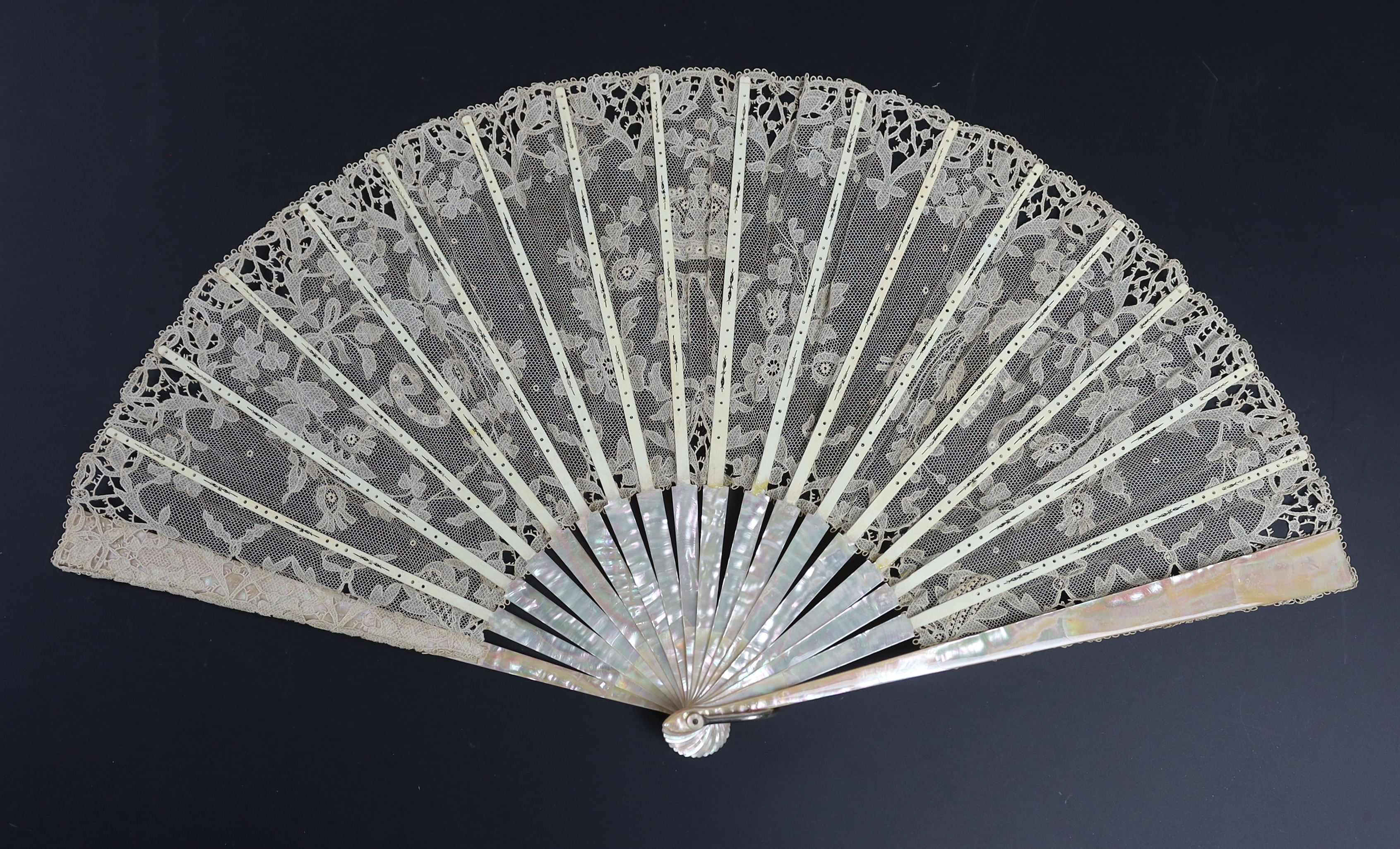 An unusual commemorative Carrickmacross lace fan, possibly one made and entered for a group of competitions held by the Worshipful Company of Fan Makers, the winning fan to be presented to Queen Victoria as a gift for he